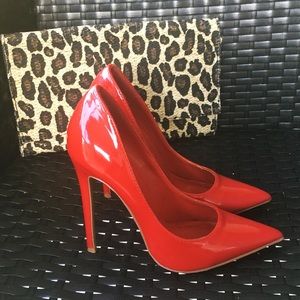Red pointed toe pumps